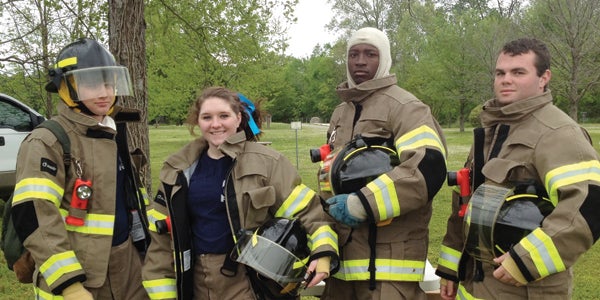 Ray Odom, Emily McGhee, Stone Leahmann and Ashton Wilson, students at the Escambia Career Readiness Center, braved the wind and cold temps to show off their skills at the school’s career tech day in the park Tuesday.