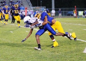 WSN player makes a tackle in Friday night's win over Clarke County.