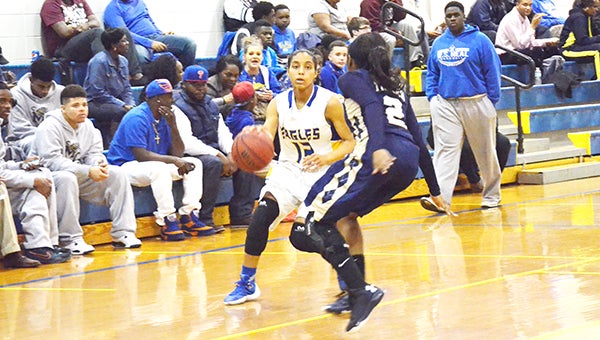 Neal's Keke Floyd dribbles to the basket. Floyd had 33 points for the game.