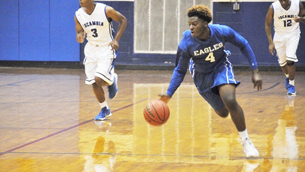 Andrew Garner | The Atmore Advance Neal's Treylon Watson looks to make a play in the open court.