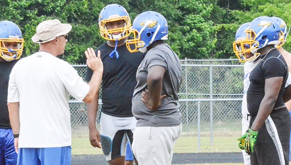 Corey Williams | The Brewton Standard WSN head football coach Doug Hoehn speaks with linemen at spring practice.
