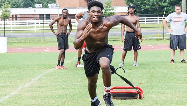 Corey Williams | The Brewton Standard Michael Campbell  sprints in the sled pull. 