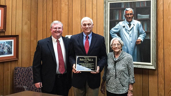 Courtesy photo Bernie Wall receives  a distinguished service award by the Escambia County Healthcare Authority. Here he is pictured with D.W. McMillan administrator Chris Griffin, and chairman Ruth Harrell.