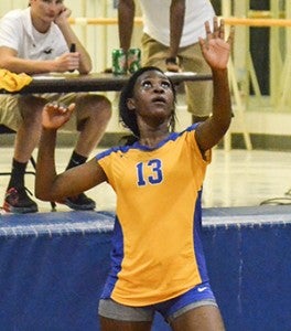 Corey Williams | The Brewotn Standard Dinah Samuel serves the ball for the Lady Eagles. Neal will face Excel on Aug. 25.  
