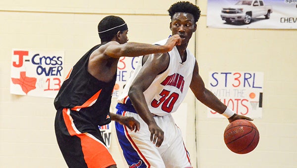 Corey Williams | The Brewton Standard C.J. Perry brings the ball up court versus Marion Military on Saturday. Marion Military’s defense forced the Warhawks into 26 turnovers for the game